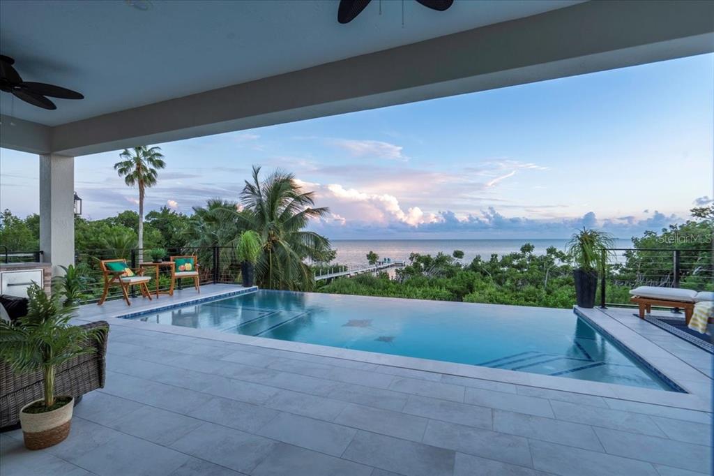 1000 68th Street Marathon, FL 33050 - Photo 66 of 75 a view of a swimming pool with a patio