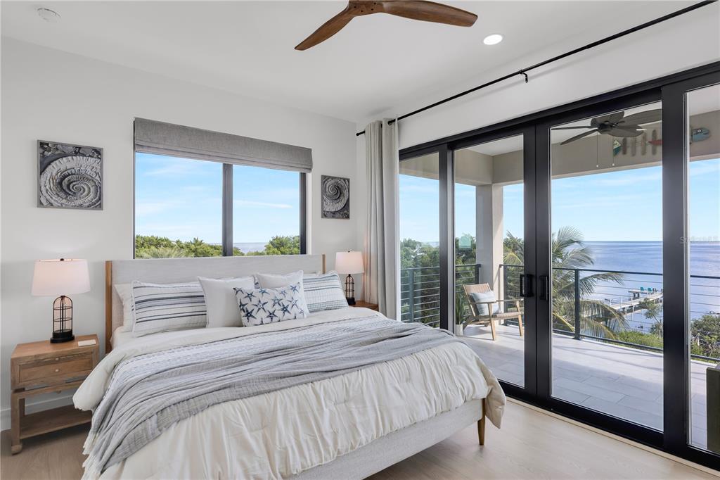 1000 68th Street Marathon, FL 33050 - Photo 74 of 75 a bedroom with a large bed and a window