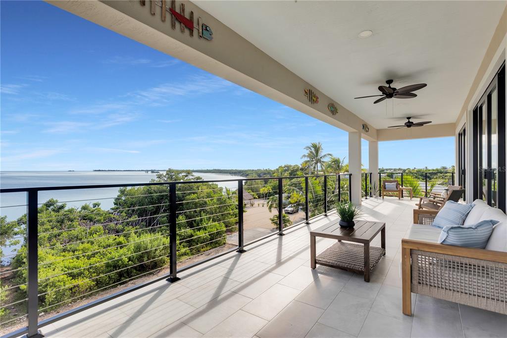 1000 68th Street Marathon, FL 33050 - Photo 75 of 75 a living room with furniture and a floor to ceiling window