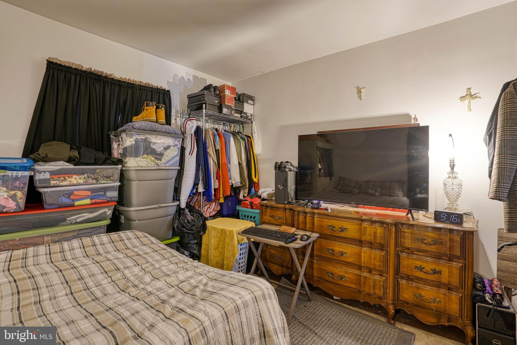 1200 Race Street Cambridge, MD 21613 - Photo 11 of 18 a bedroom with a bed and a flat screen tv