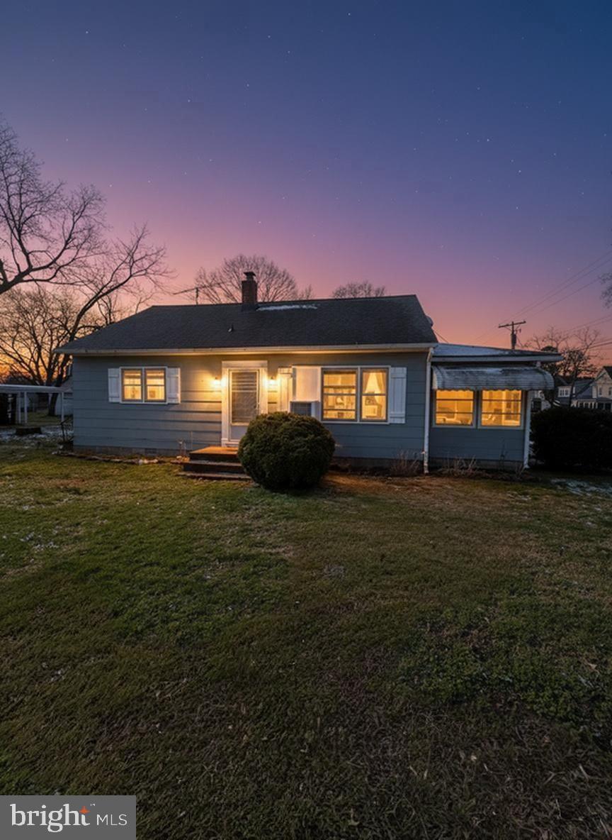 1200 Race Street Cambridge, MD 21613 - Photo 2 of 18 a front view of a house having yard