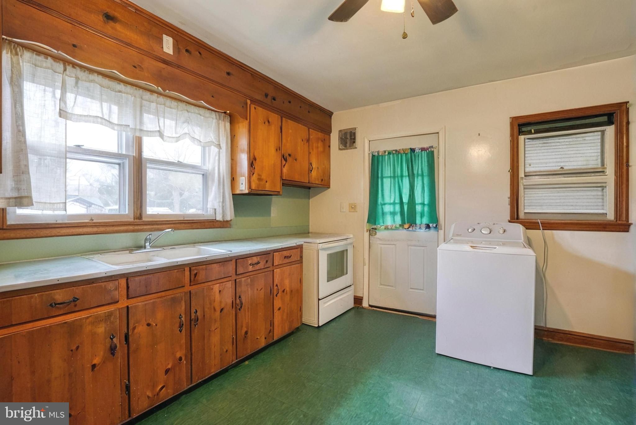 1200 Race Street Cambridge, MD 21613 - Photo 6 of 18 a kitchen with sink and cabinets