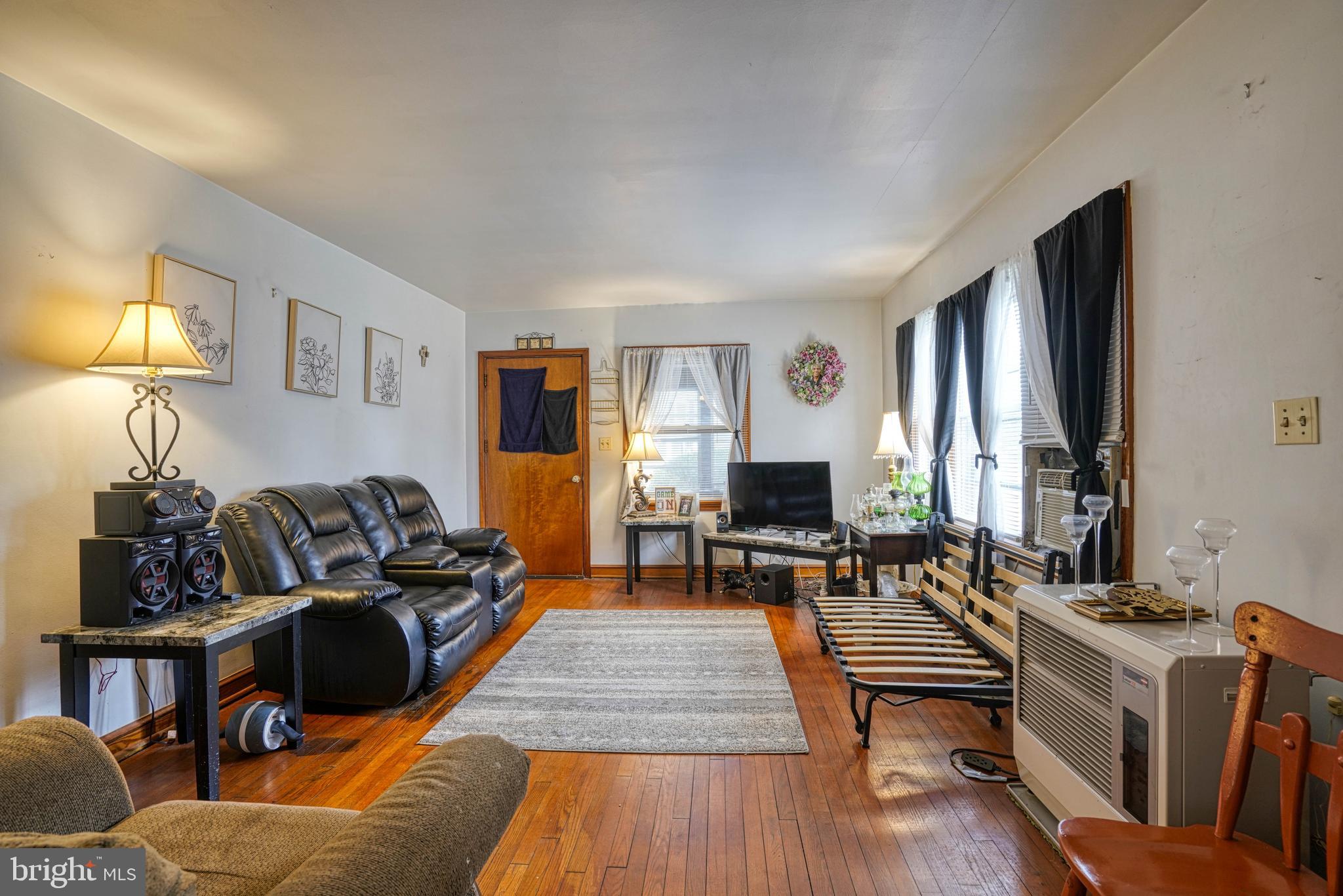 1200 Race Street Cambridge, MD 21613 - Photo 8 of 18 a living room with furniture wooden floor and a table