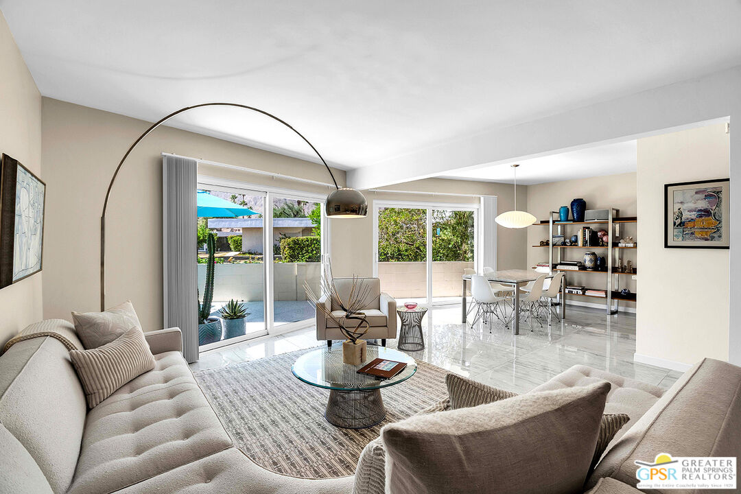 1855 Ramon Road, Unit 8 Palm Springs, CA 92264 - Photo 1 of 1 a living room with furniture and a large window