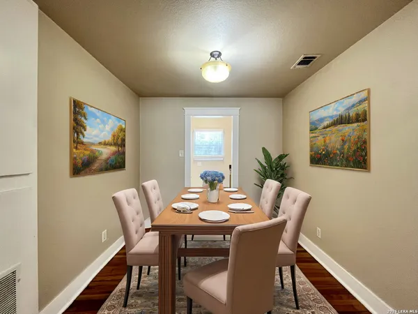 a dining room with furniture and window