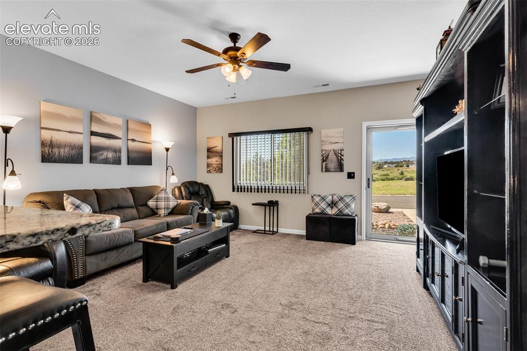 415 Empire Road Canon City, CO 81212 - Photo 11 of 40 a living room with furniture and a flat screen tv