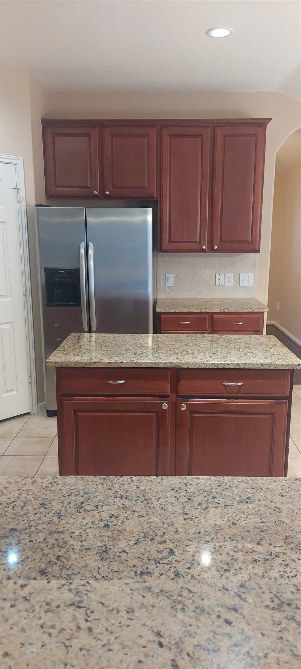 2310 Appian Way Pearland, TX 77584 - Photo 12 of 15 a kitchen with wooden cabinets