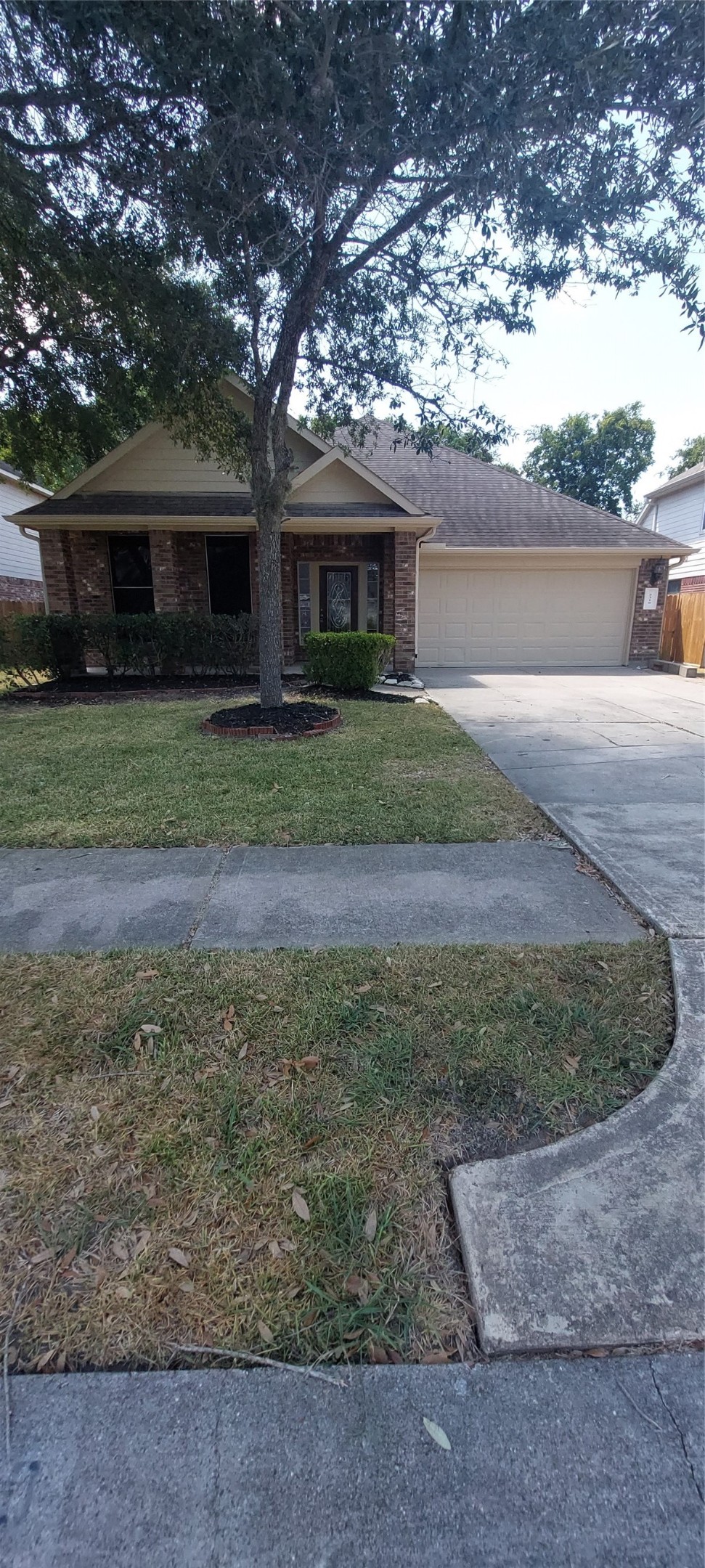 2310 Appian Way Pearland, TX 77584 - Photo 2 of 15 a front view of a house with a yard