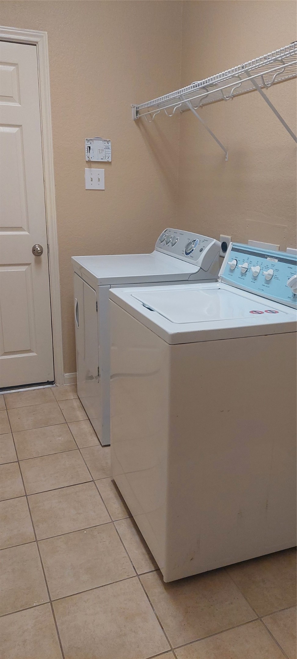 2310 Appian Way Pearland, TX 77584 - Photo 4 of 15 a utility room with washer and dryer