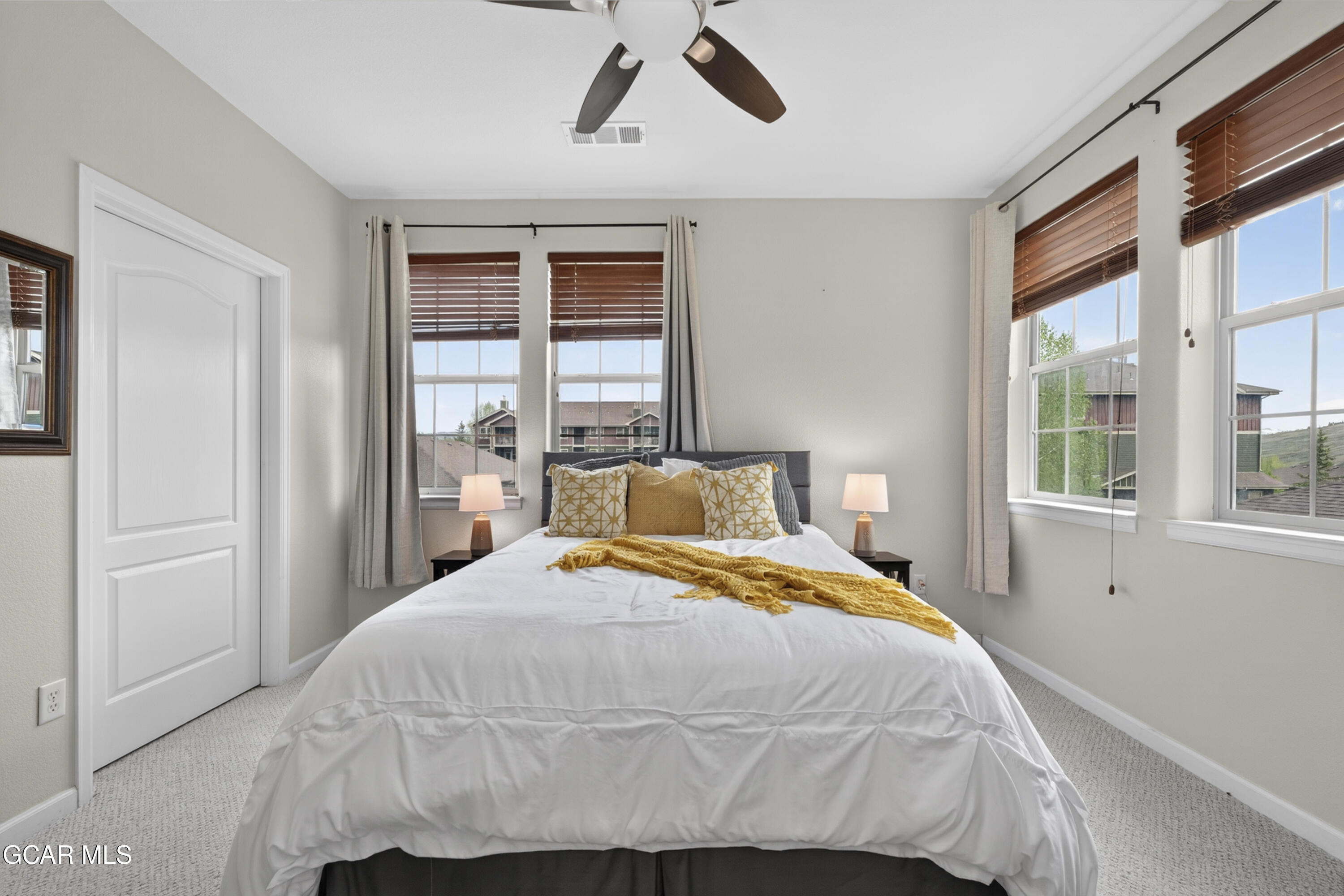 158 Village Road Granby, CO 80446 - Photo 12 of 46 a bedroom with a bed and window
