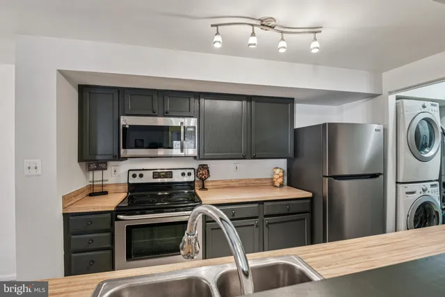 a view of a livingroom with furniture and stairs