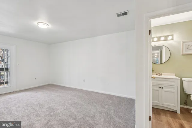wooden floor in an empty room with a fireplace