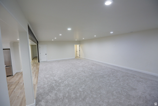 126 North 800 West Mapleton, UT 84664 - Photo 50 of 79 Finished below grade area with freestanding refrigerator, recessed lighting, and light carpet
