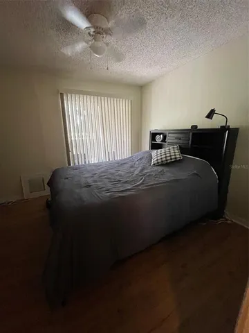 a bedroom with a bed and window
