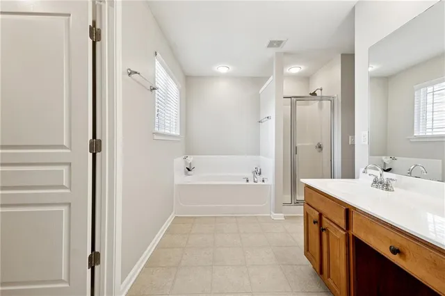 a bathroom with a sink a mirror and a bathtub