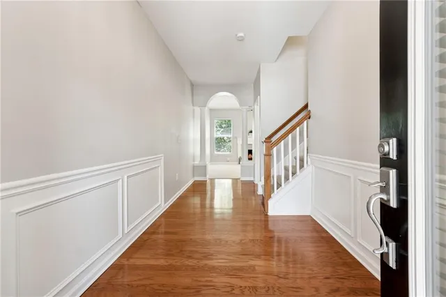a view of an entryway with wooden floor