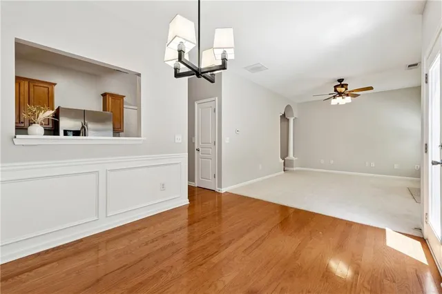 a view of a room with wooden floor