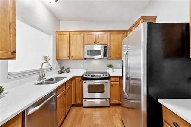 a kitchen with a stove and a refrigerator