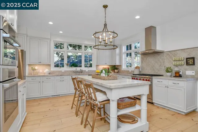 a kitchen with appliances cabinets and a sink