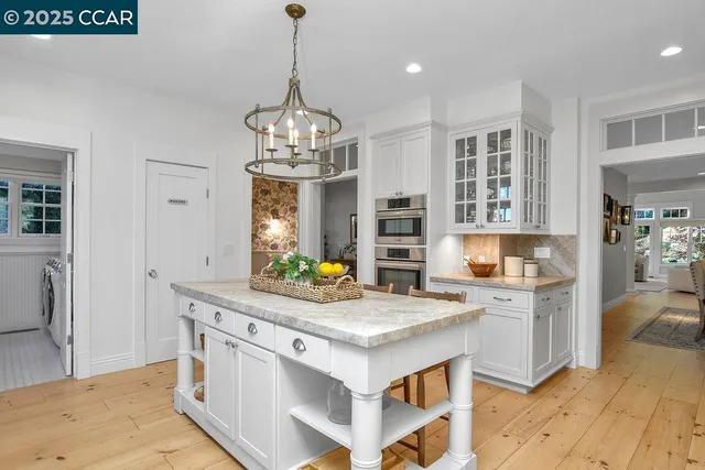 a bathroom with a sink mirror and vanity