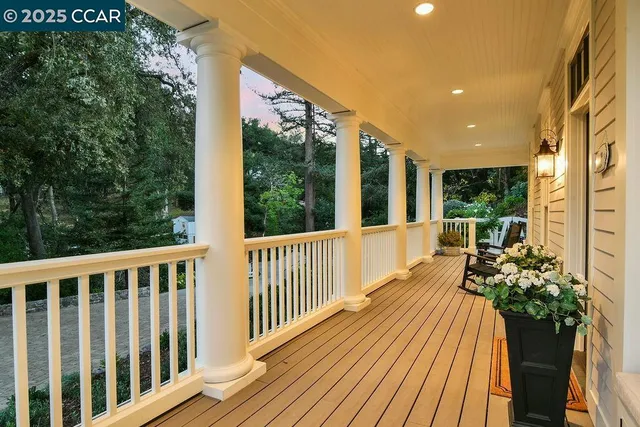 a view of a hallway with wooden floor and entryway