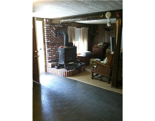 490 Town Farm Road Coventry, RI 02816 - Photo 17 of 18 Exterior Front. lower level family room w/woodstove. Walks out to side yard on the water