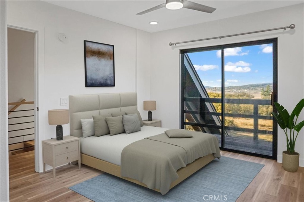 59470 Burnt Valley Road Anza, CA 92539 - Photo 15 of 18 a bedroom with a large bed and a large window