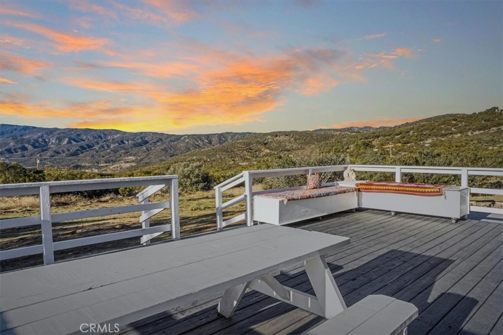 59470 Burnt Valley Road Anza, CA 92539 - Photo 3 of 18 a view of a chairs and table on the roof deck