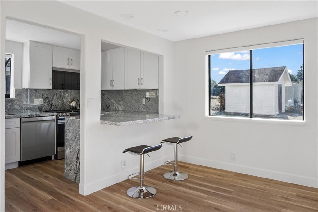 59470 Burnt Valley Road Anza, CA 92539 - Photo 4 of 18 a living room with a couch and a floor to ceiling window