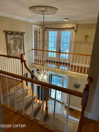 a view of staircase with a large window