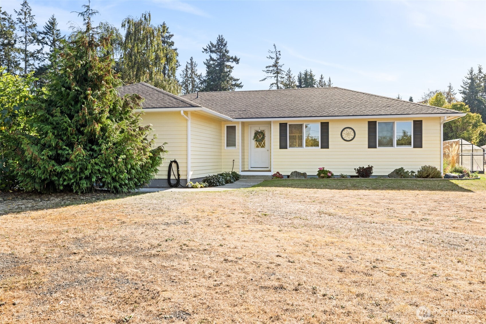 92 Robbins Road Sequim, WA 98382 - Photo 1 of 39 a front view of a house with yard