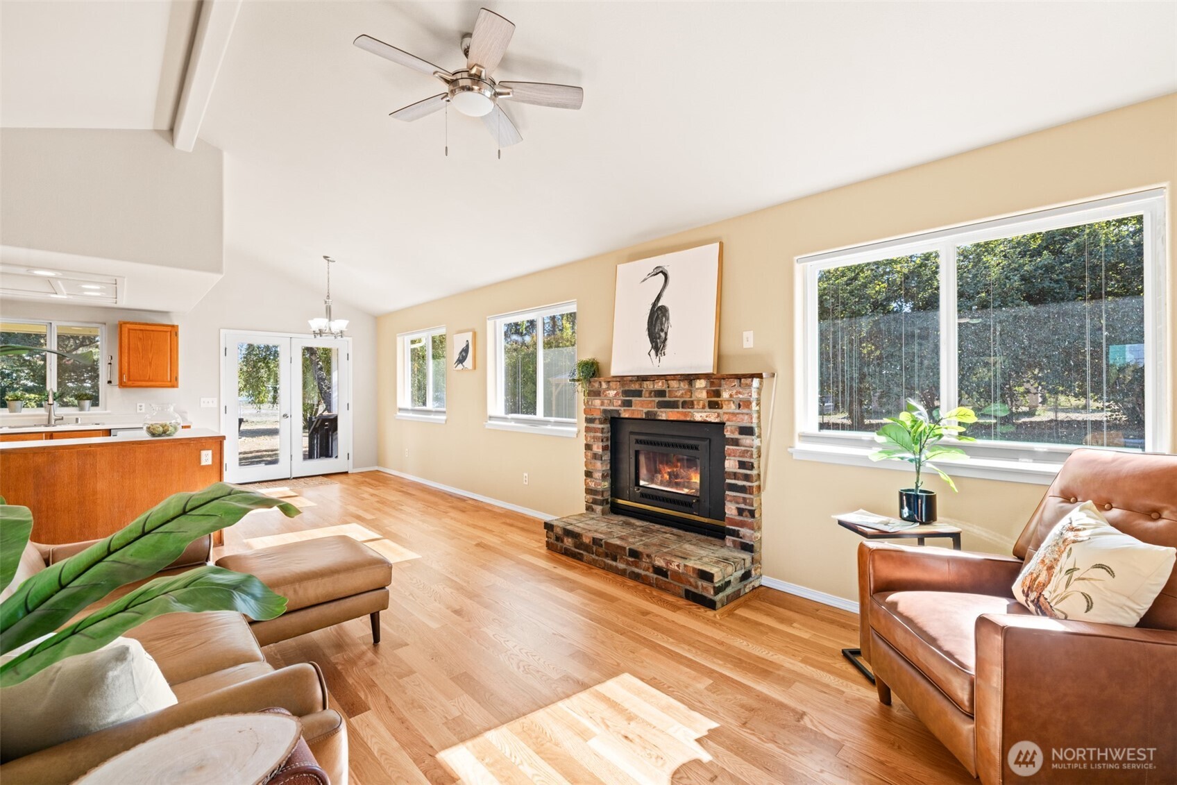 92 Robbins Road Sequim, WA 98382 - Photo 13 of 39 a living room with furniture a flat screen tv and a fireplace