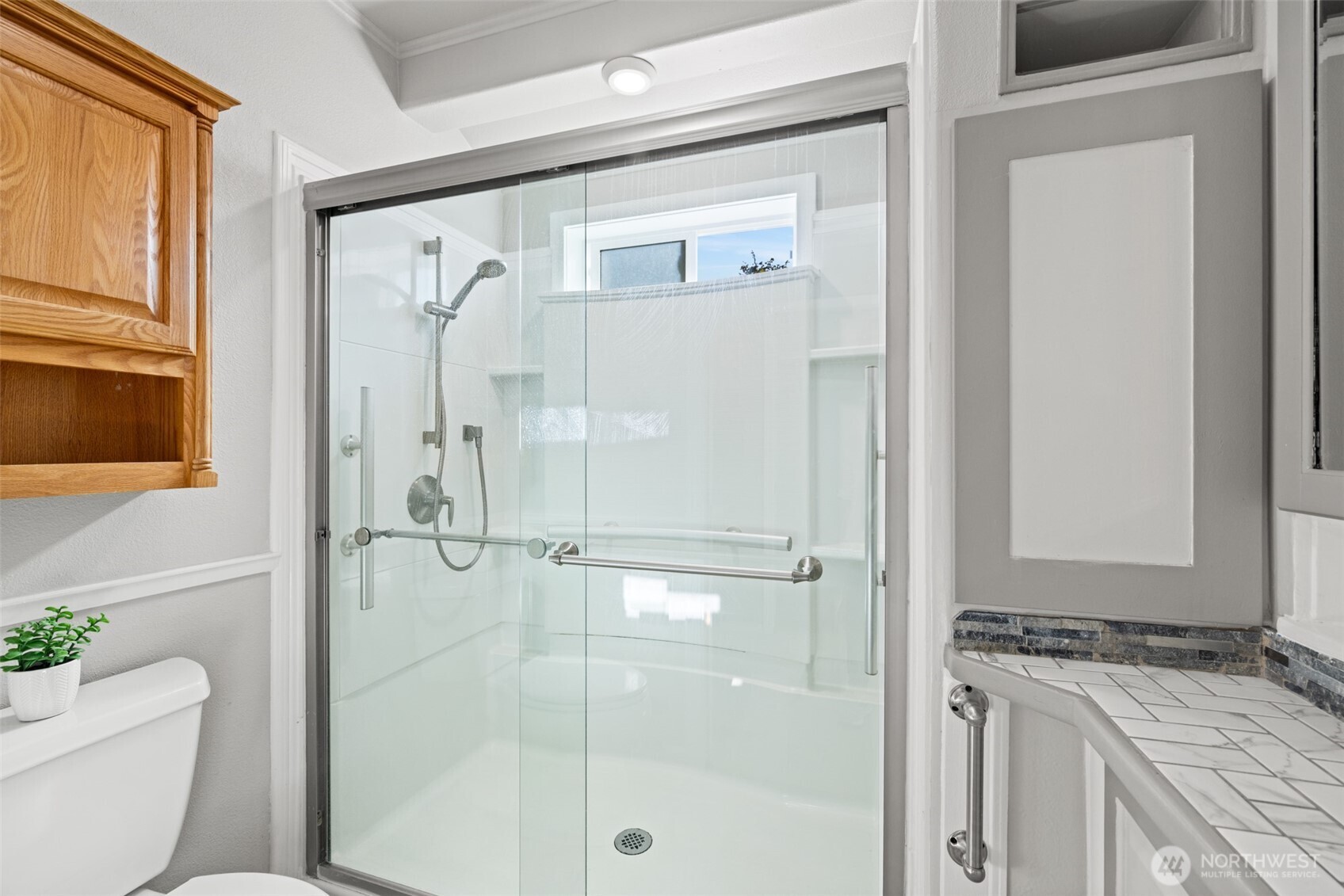 92 Robbins Road Sequim, WA 98382 - Photo 19 of 39 a bathroom with a granite countertop sink toilet and shower