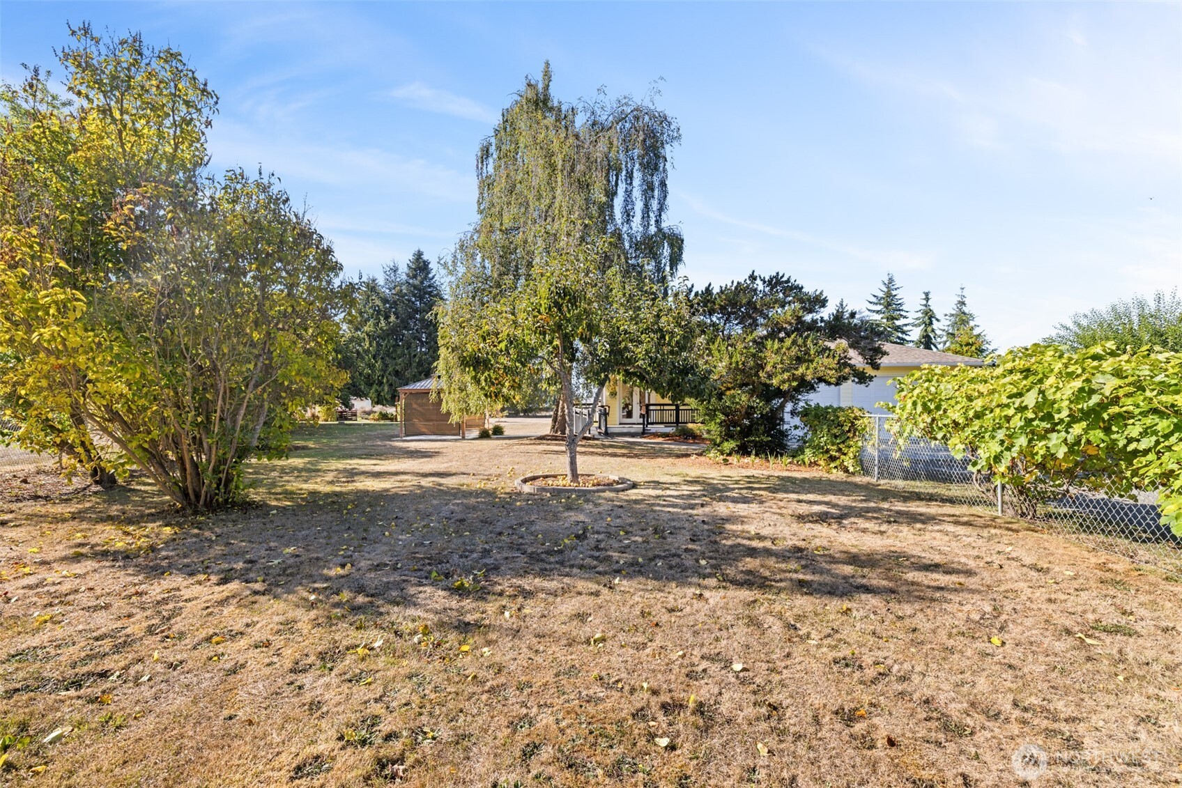 92 Robbins Road Sequim, WA 98382 - Photo 39 of 39 a view of a yard with plants and trees