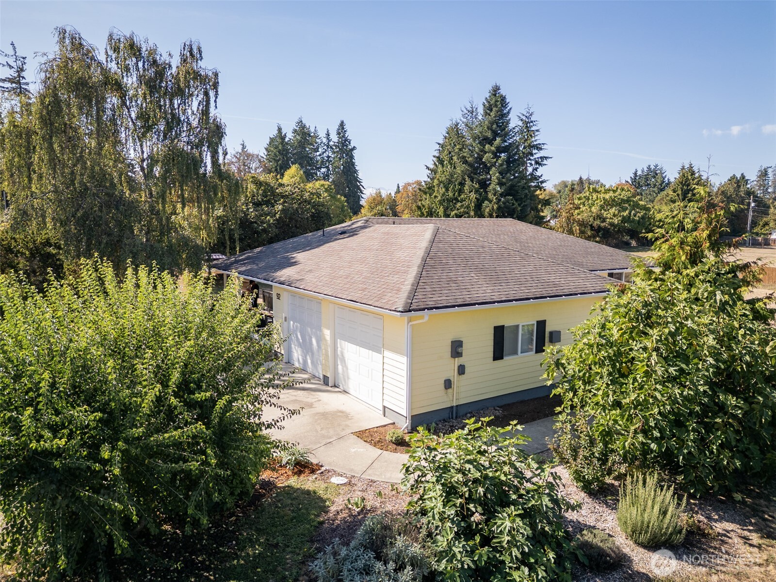 92 Robbins Road Sequim, WA 98382 - Photo 5 of 39 a view of a house with a yard and plants