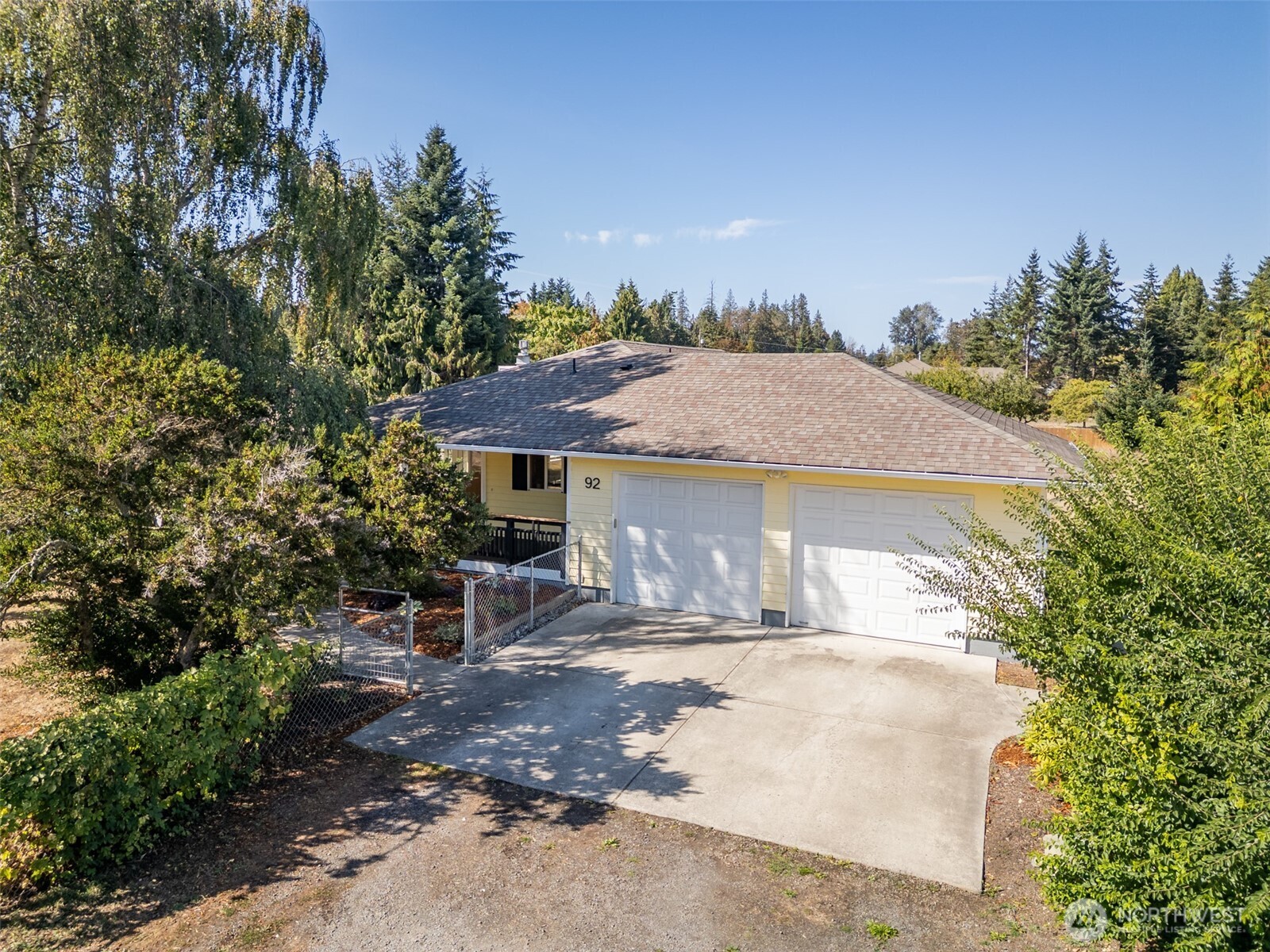 92 Robbins Road Sequim, WA 98382 - Photo 6 of 39 a view of a house with a yard and large tree