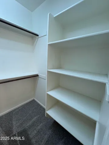 a kitchen with a dining table and chairs