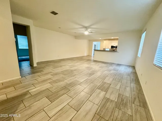 a open kitchen with stainless steel appliances granite countertop a sink and a stove