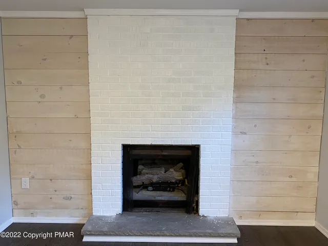 a living room with a fireplace