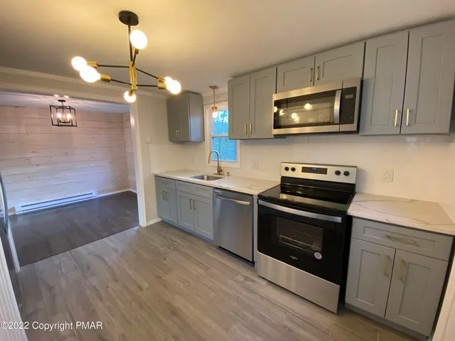 a kitchen with a sink and a microwave