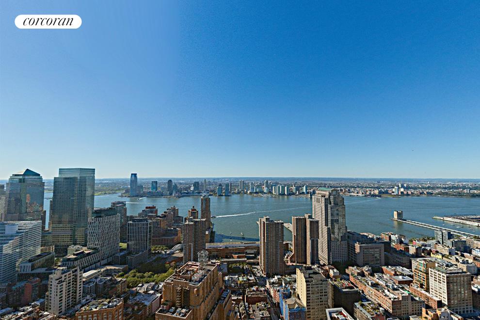 56 Leonard Street, Unit PH53 Manhattan, NY 10013 - Photo 1 of 7 a view of city and ocean with boats