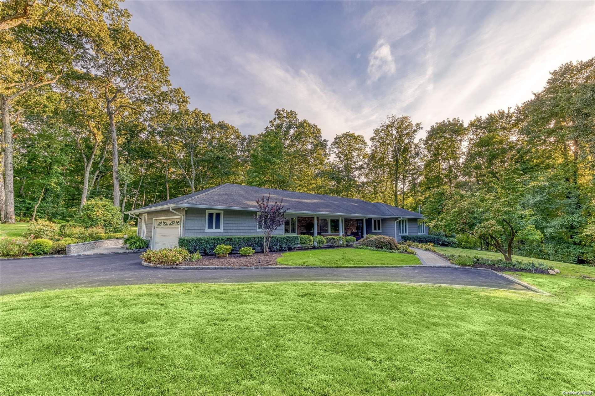 a view of a house with a yard and plants