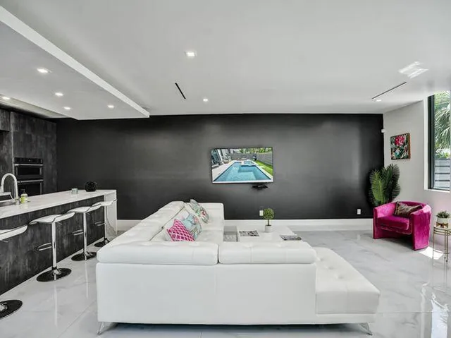 a bedroom with a bed and a couch