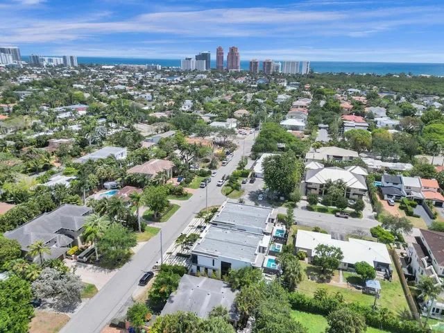an aerial view of residential houses with outdoor space
