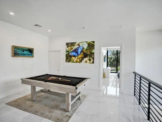 a view of a livingroom with furniture and wooden floor