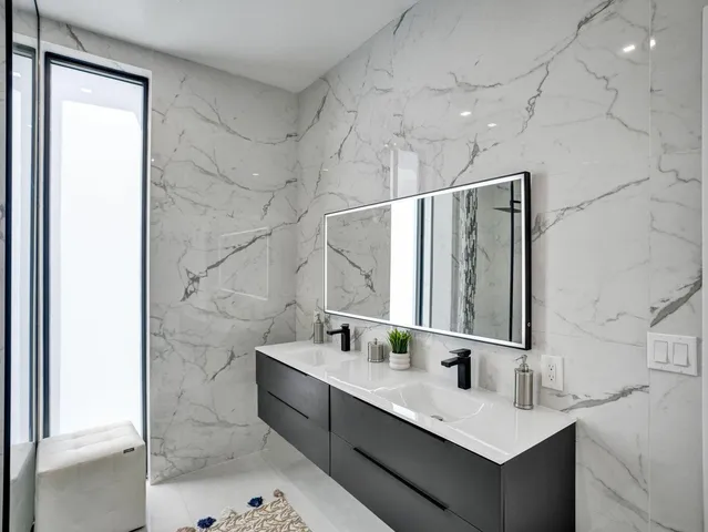 a bathroom with a bathtub and shower