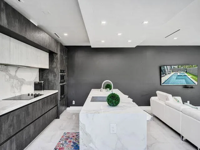 a kitchen with a sink a stove and refrigerator