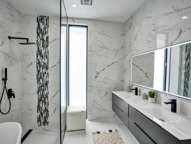 a bathroom with a double vanity sink and mirror