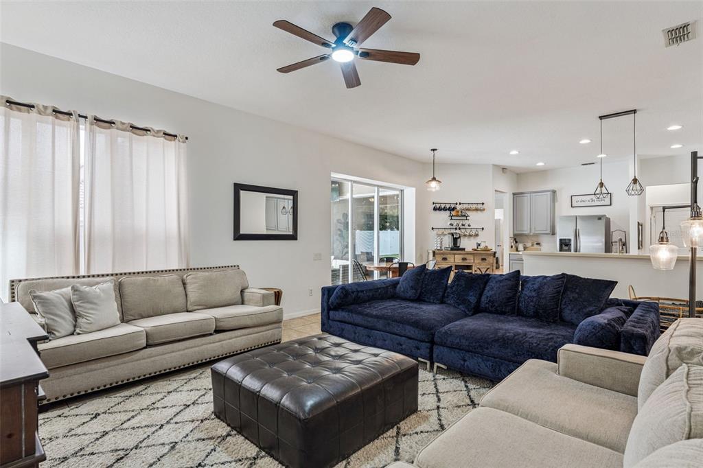 11162 Ledgement Lane Windermere, FL 34786 - Photo 15 of 55 a living room with furniture and a chandelier