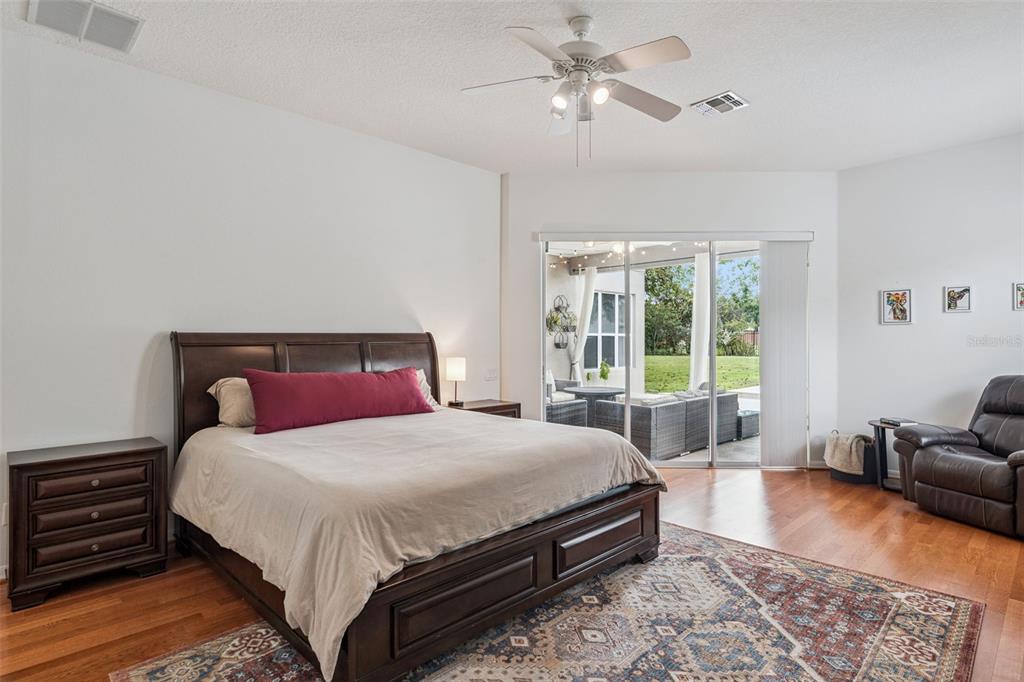 11162 Ledgement Lane Windermere, FL 34786 - Photo 20 of 55 a bedroom with a large bed and a couch